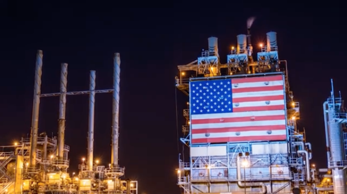 American flag and factory