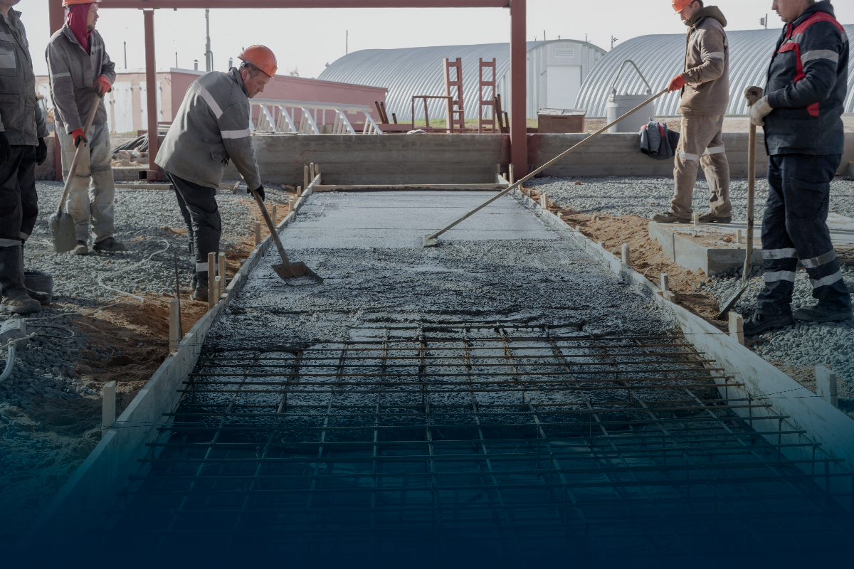 men pouring concrete